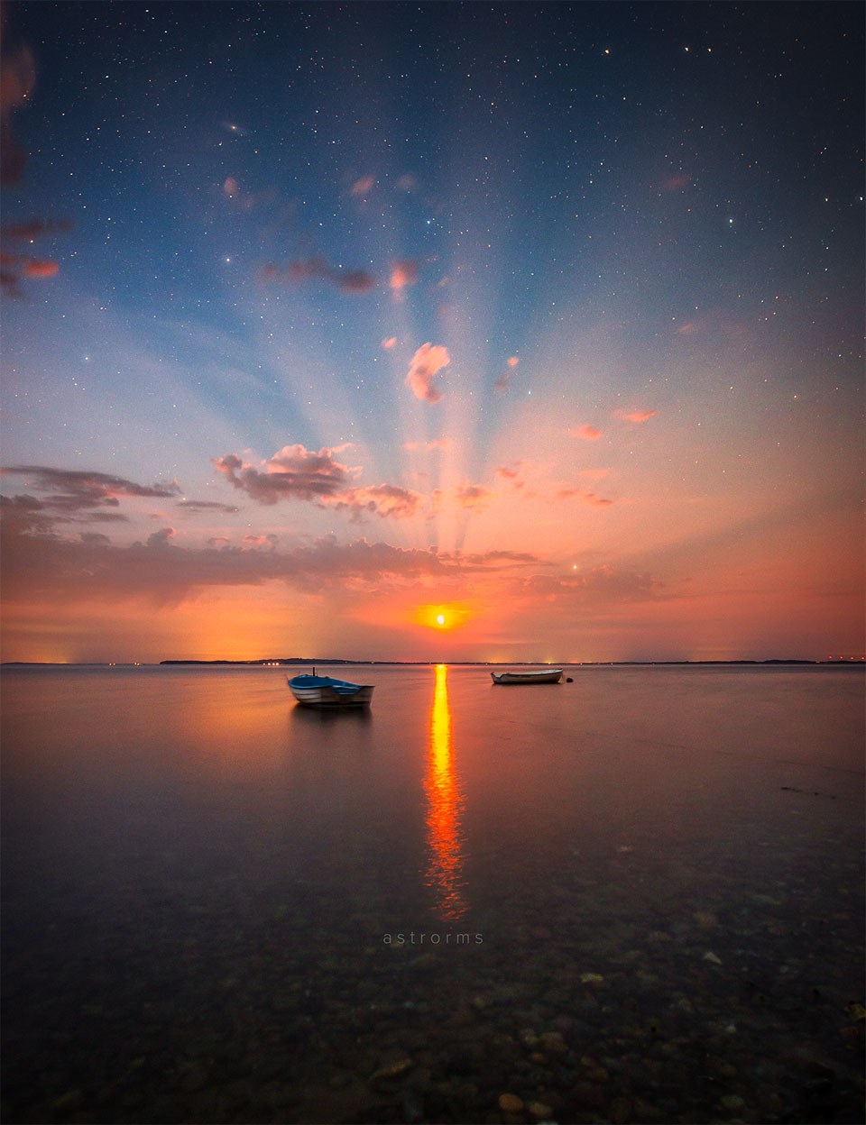 APOD: 2022 July 27 – Crepuscular Moon Rays over Denmark