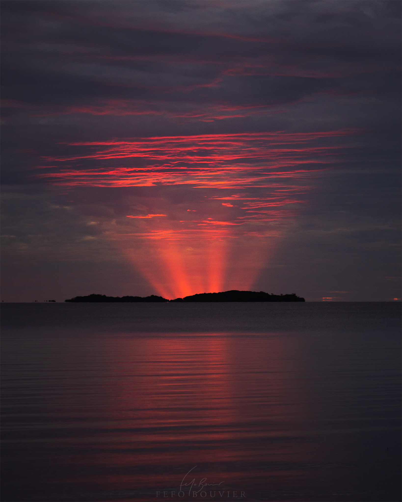 APOD: 2022 May 30 – Red Crepuscular Rays from an Eclipse