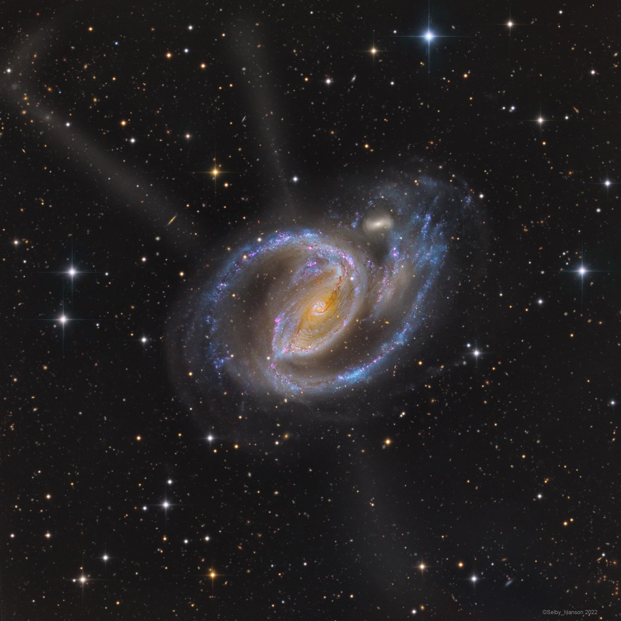 APOD: 2022 November 16 – In the Arms of NGC 1097