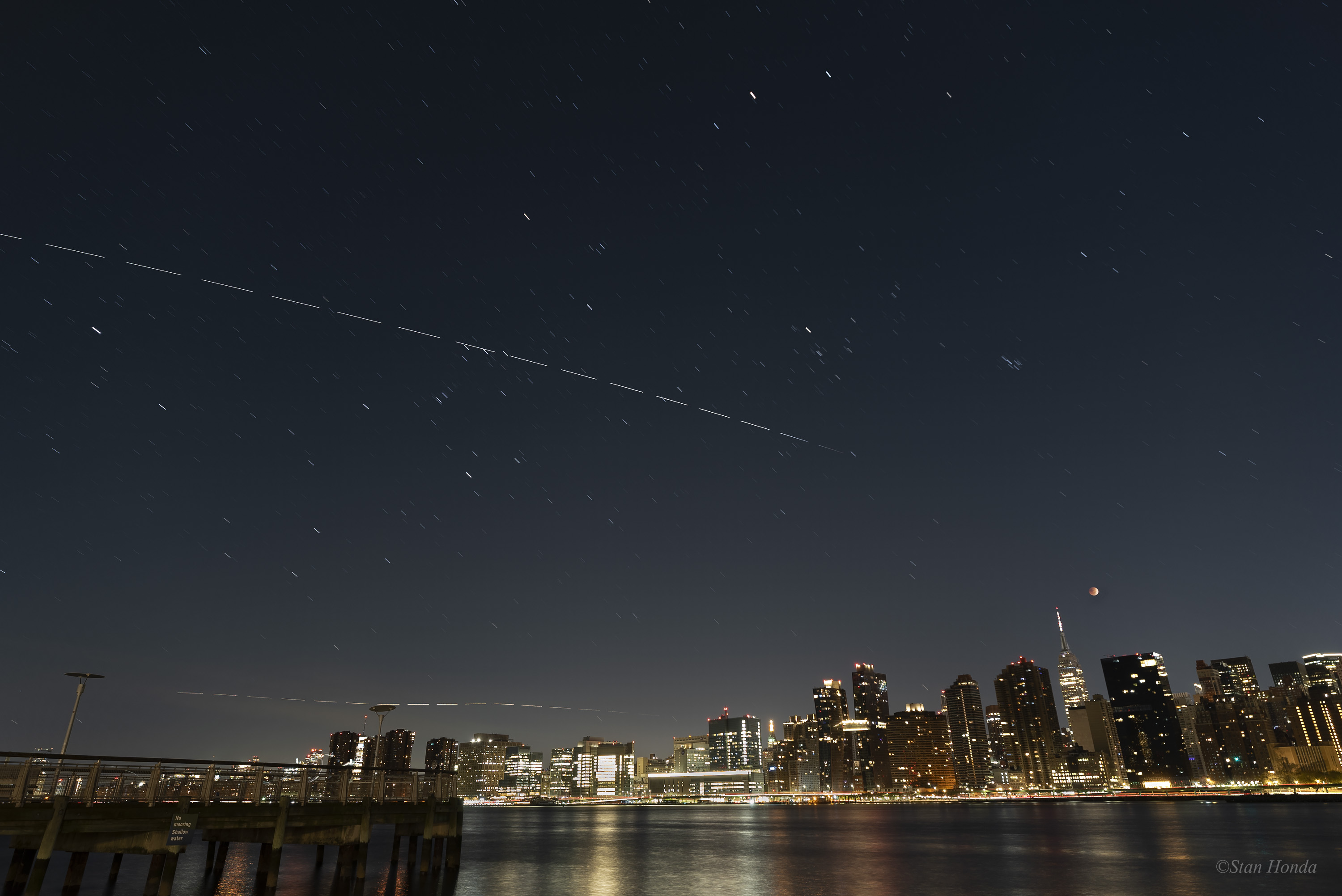 APOD: 2022 November 12 – Eclipse in the City
