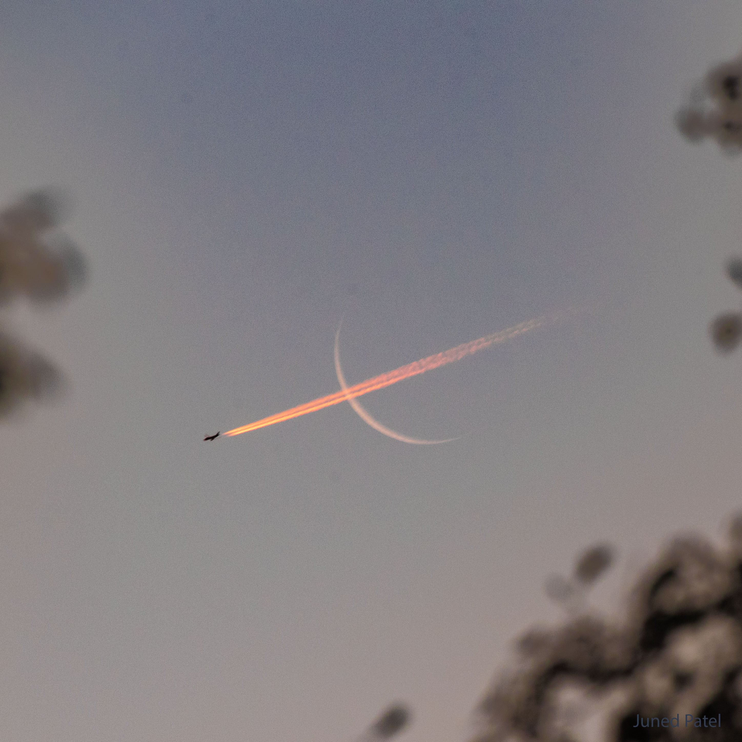 APOD: 2023 December 4 – Plane Crossing Crescent Moon