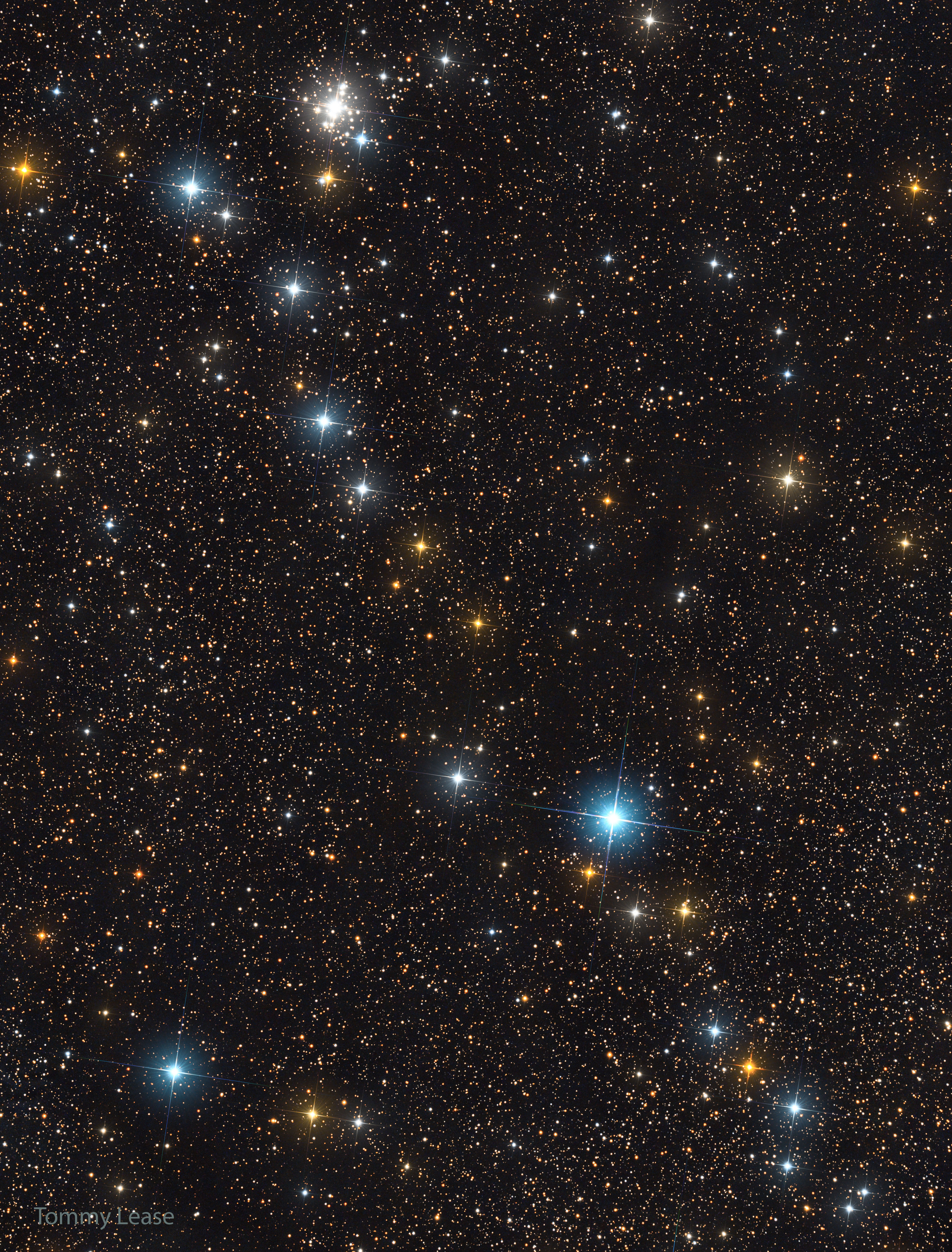 The featured image shows a line of bright stars strewn diagonally across a starfield of more dim stars. A cluster of stars is also visible near the top left of the image. Please see the explanation for more detailed information.