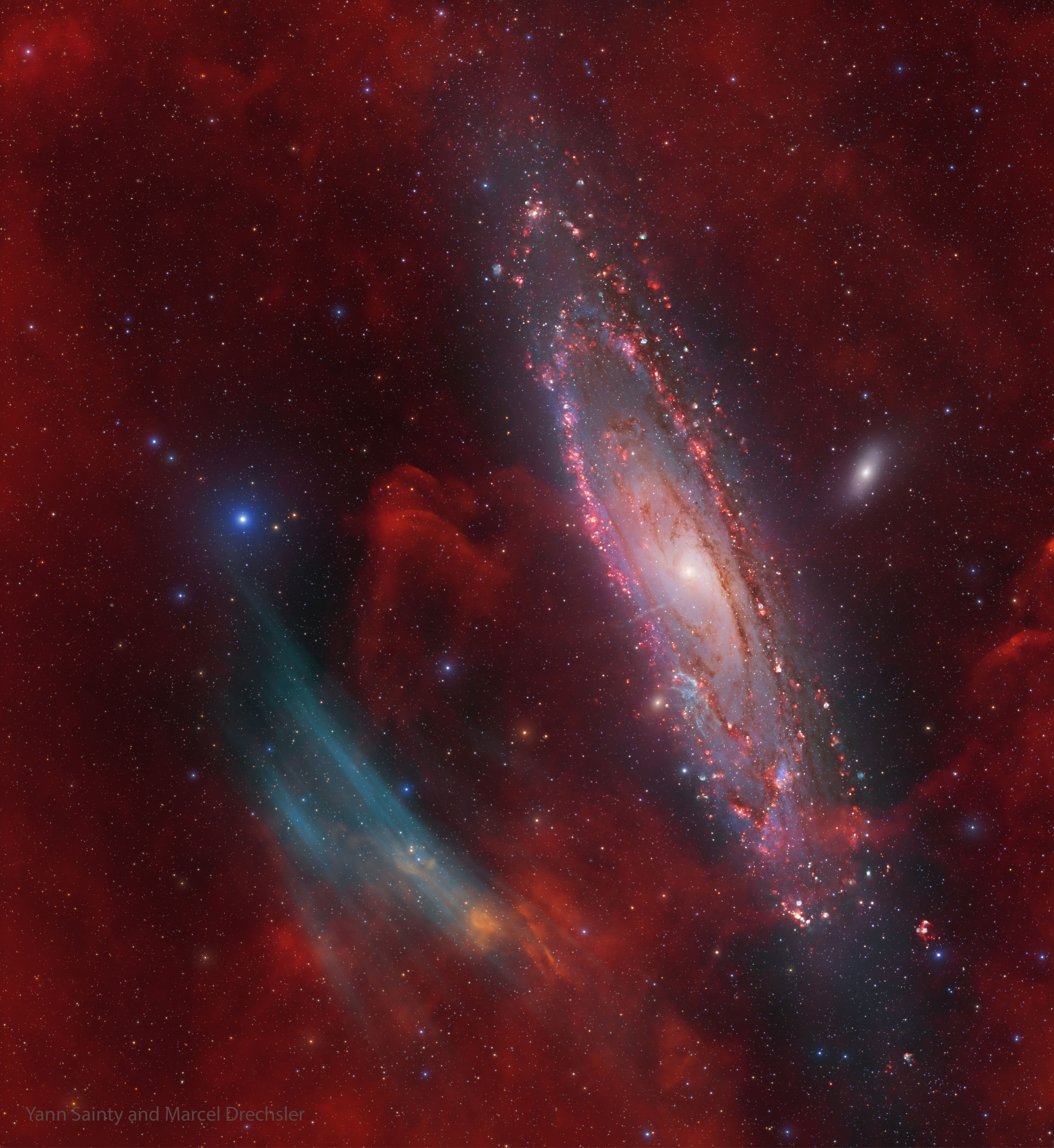 A deep image of M31, the Andromeda galaxy, shows unexpected oxygen-glowing arcs to its left. Please see the explanation for more detailed information.