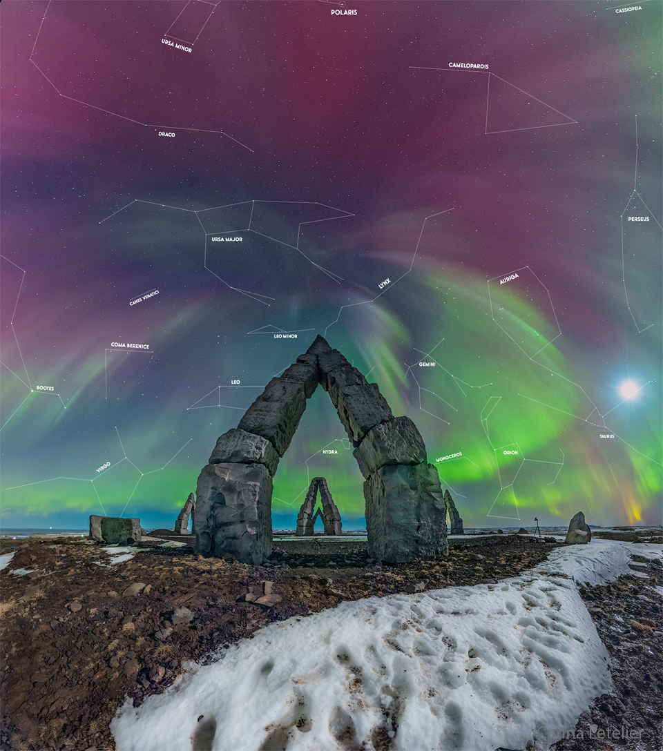 Multi-colored aurora are seen above an unusual stone gateway, the first of several similar gateways seen in the distance. Please see the explanation for more detailed information.