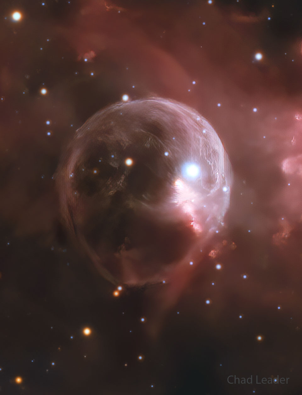A starfield is shown with a big light bubble in the center. A bright star is toward the upper right in the translucent bubble. To some, the bubble may resemble a skull. Please see the explanation for more detailed information.