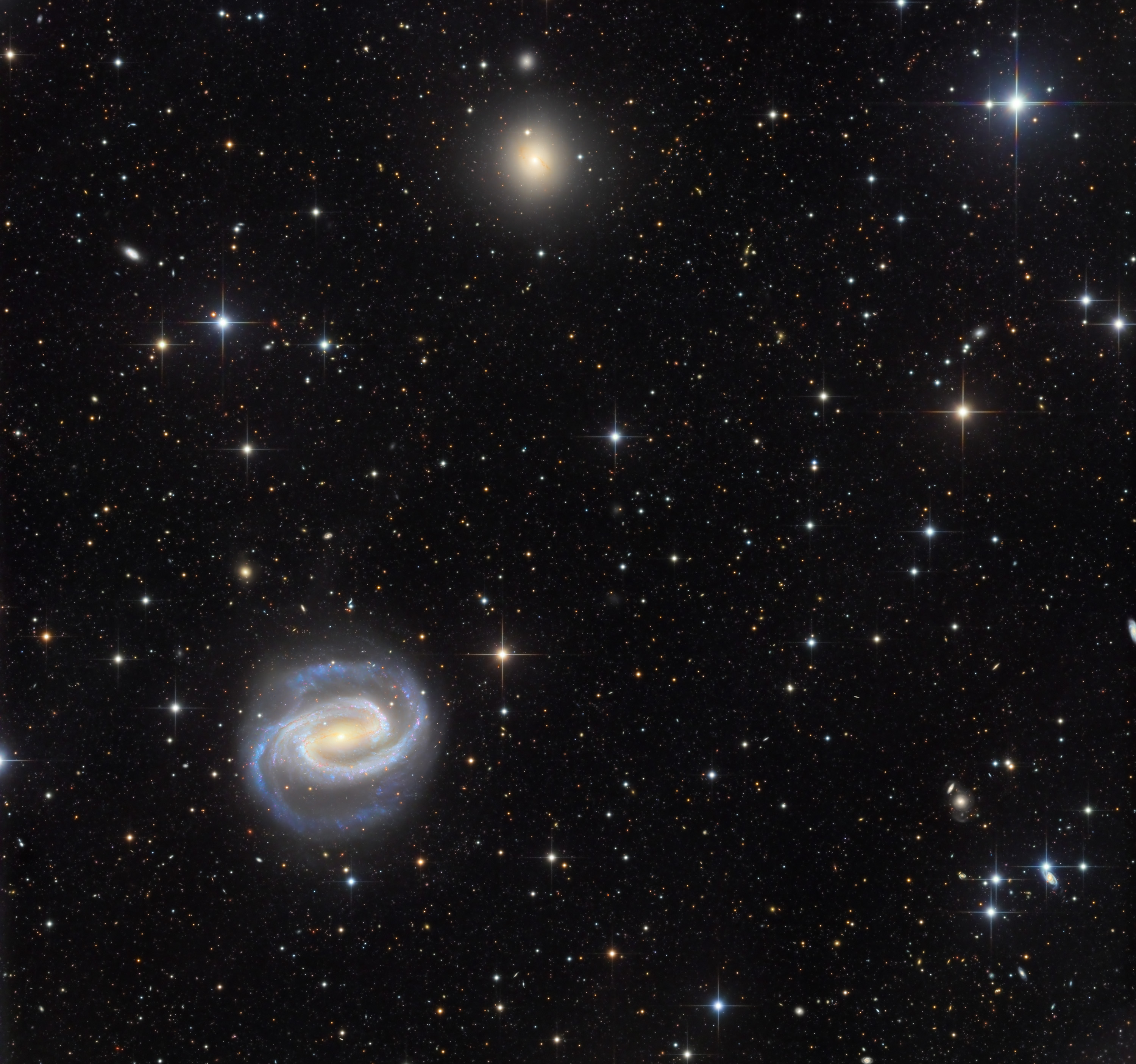 APOD: 2026 March 21 – Galaxies in the River: NGC 1300 and NGC 1297