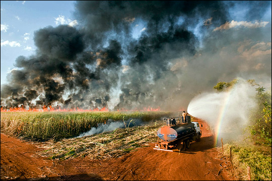 Photograph of burning fields of sugar cane in southern Brazil.