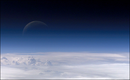 Photograph of the moon through the Earth's atmosphere taken from the International Space Station