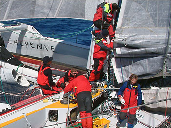 Photograph of Cheyenne's crew doing sail repairs