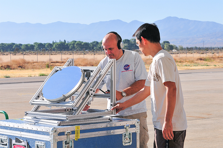 Principal investigator Haris Riris and Stewart Wu demonstrate a prototype methane sounder.