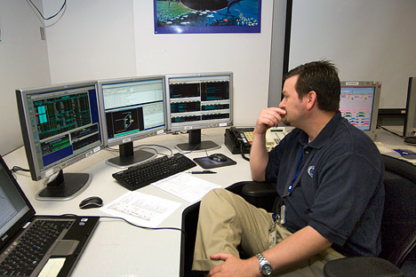 Photograph of James Palowski in the Aqua control room, NASA GSFC.