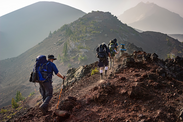A group of hikers make their way through Three Sisters Wilderness, Oregon.