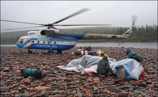 Photograph of helicopter and gear, Kotuykan River, Siberia.