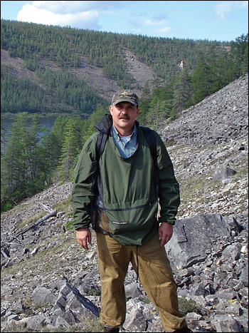 Photograph of Jon Ranson on a steep slope in the Siberian Traps.