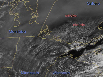 Satellite image of smoke supressing clouds along the US/Canadian border