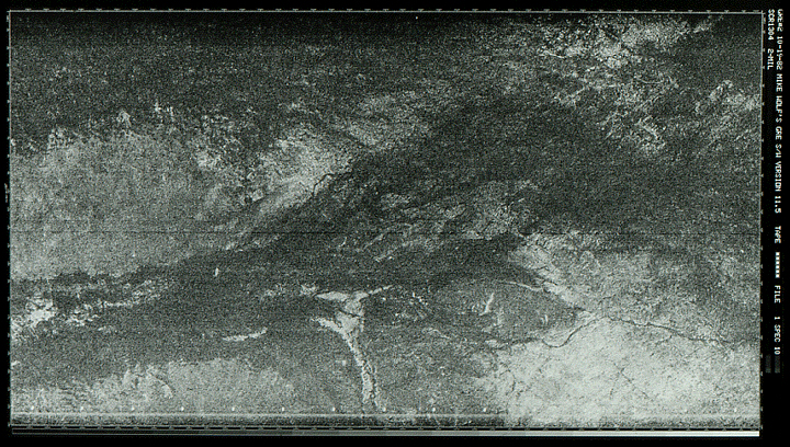 An early satellite photograph in black and white.