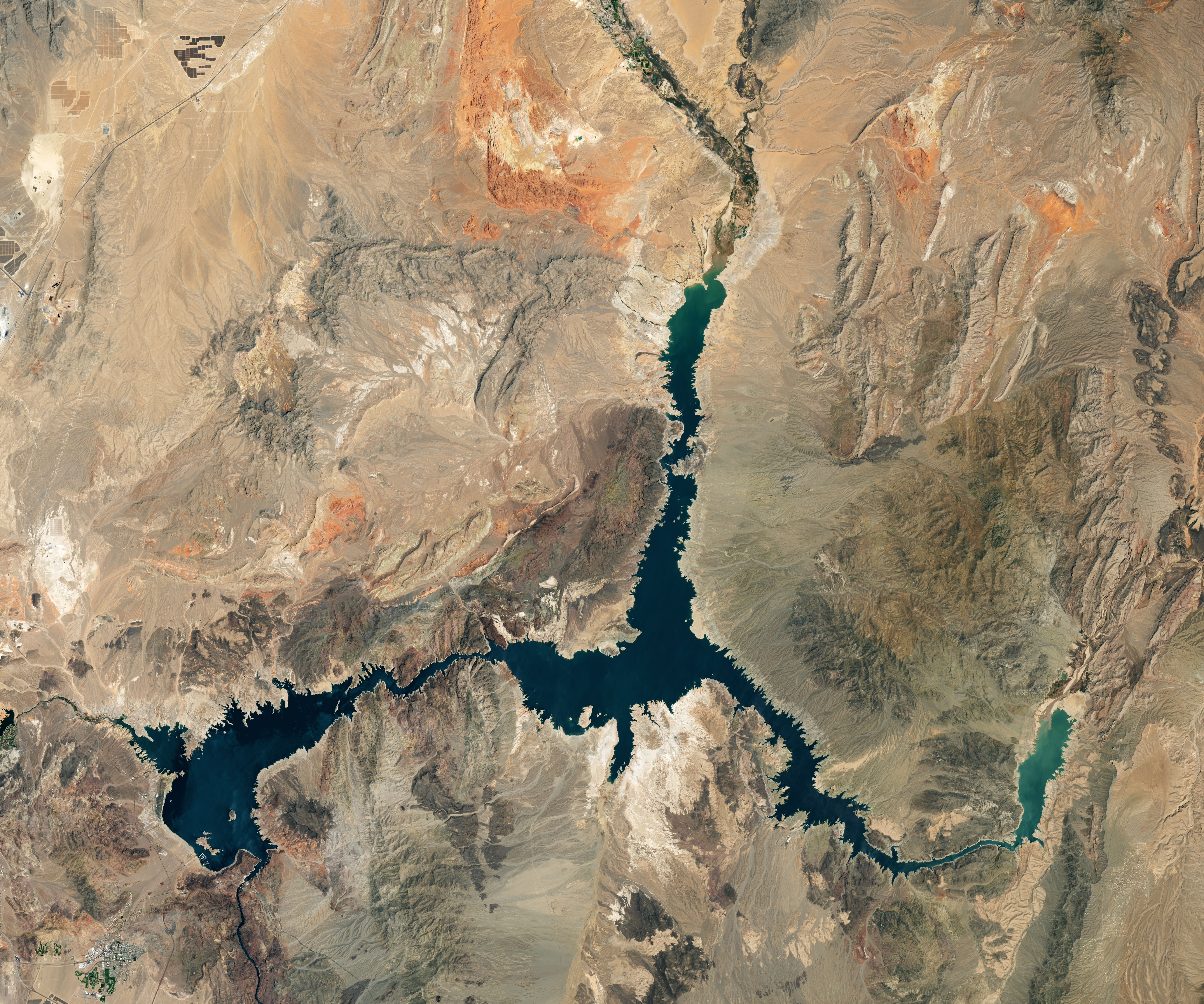 NASA Landsat satellite image of Lake Mead from July 3, 2022, showing low water levels with prominent white bathtub-ring marks where the shoreline used to be