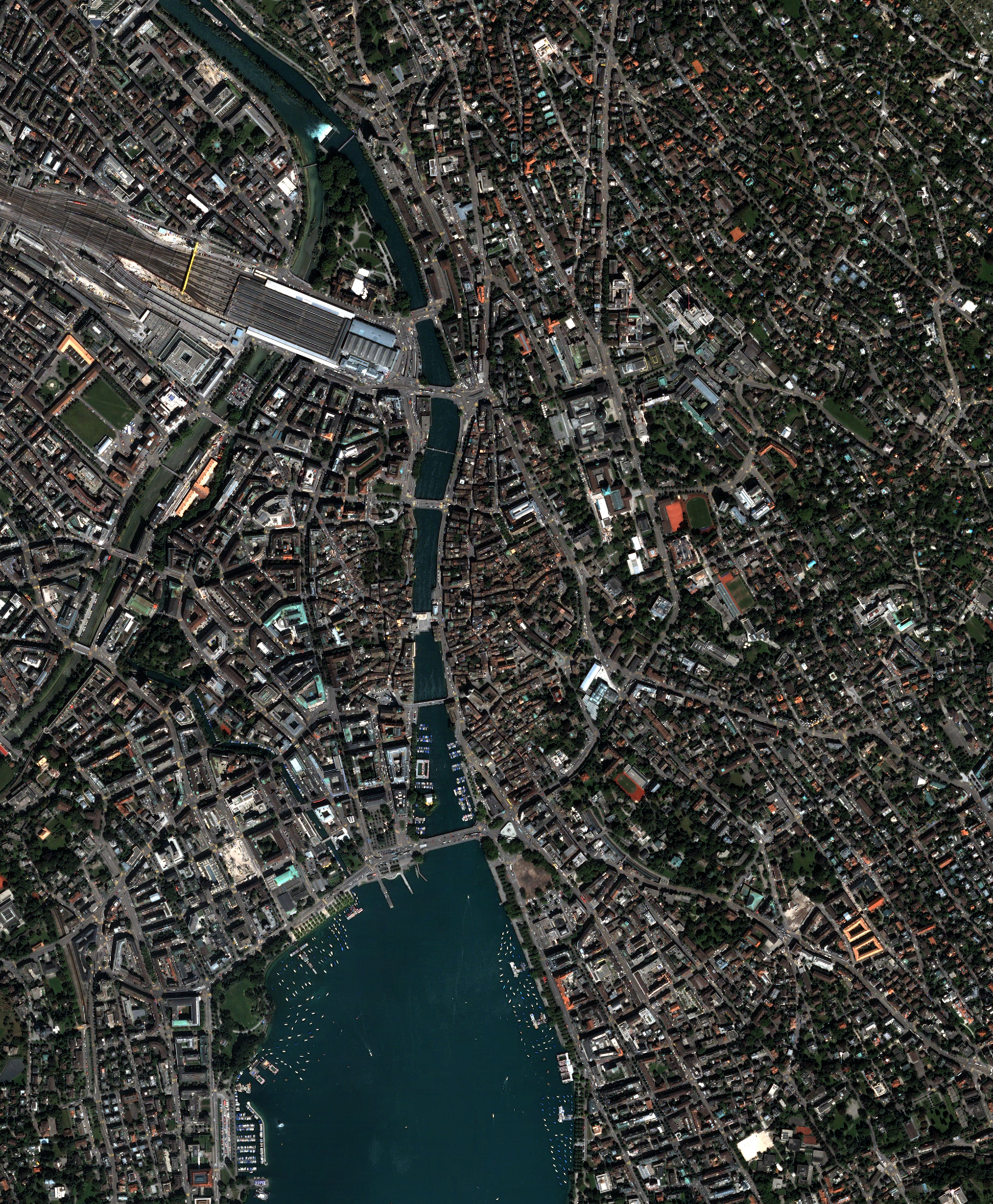 NASA Quickbird satellite high-resolution image of downtown Zurich Switzerland showing the city centre along Lake Zurich with the Limmat River the main train station the Bahnhofstrasse commercial district and the surrounding hillsides