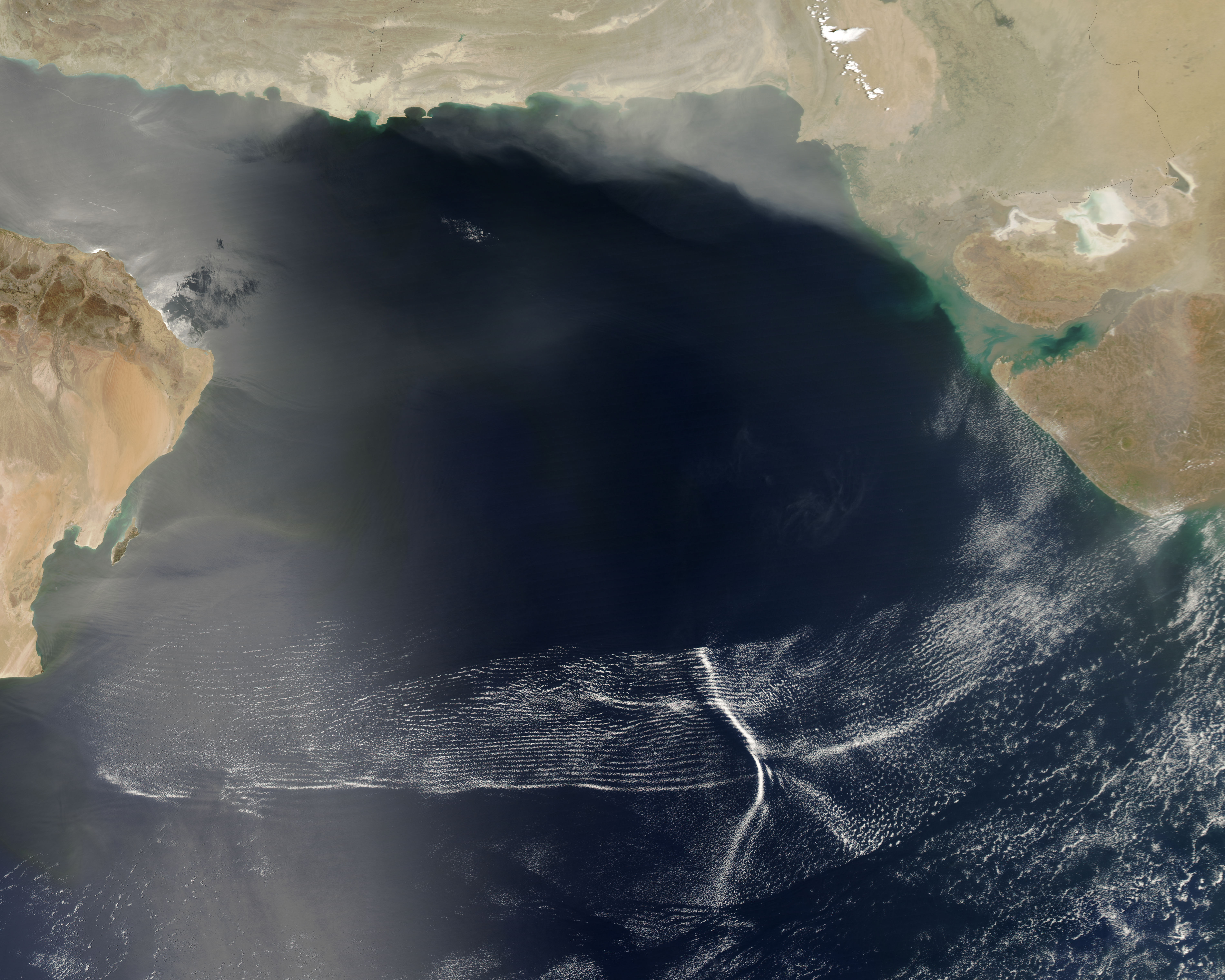 NASA MODIS satellite image from the Aqua satellite showing a massive cluster of wave clouds spanning the Arabian Sea from Oman to the western coast of India during a monsoon-system advance