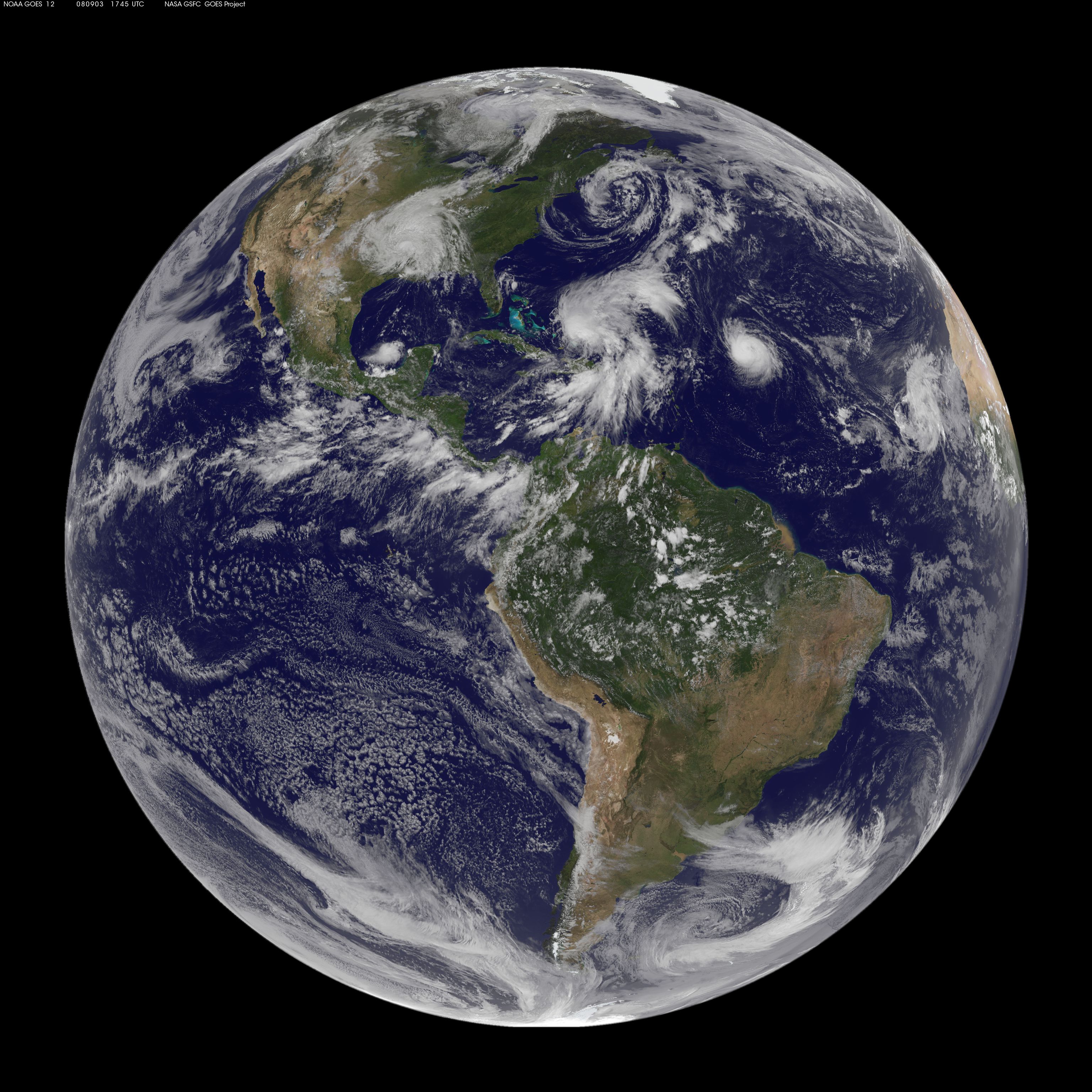 NASA satellite view of multiple storm systems across the Atlantic