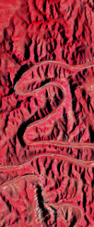 False-color Landsat satellite image showing a winding river canyon forming the number 2.