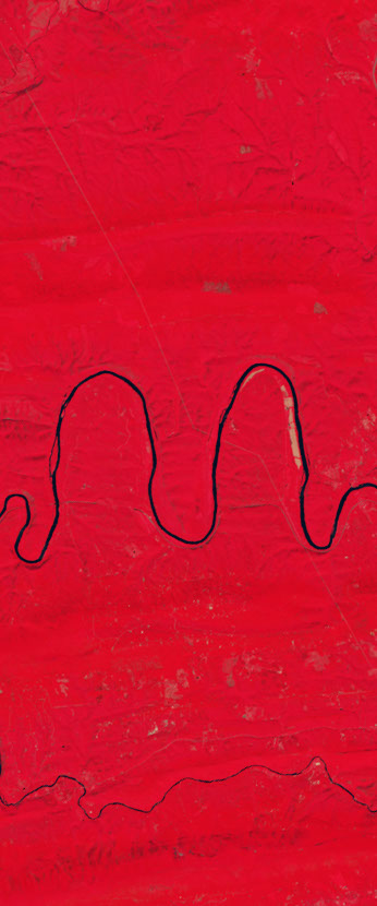 False-color Landsat satellite image showing a curvy river forming the letter m.