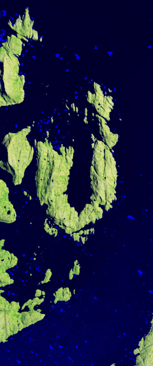 Landsat satellite image showing an island coastline forming the capital letter U surrounded by deep blue water.
