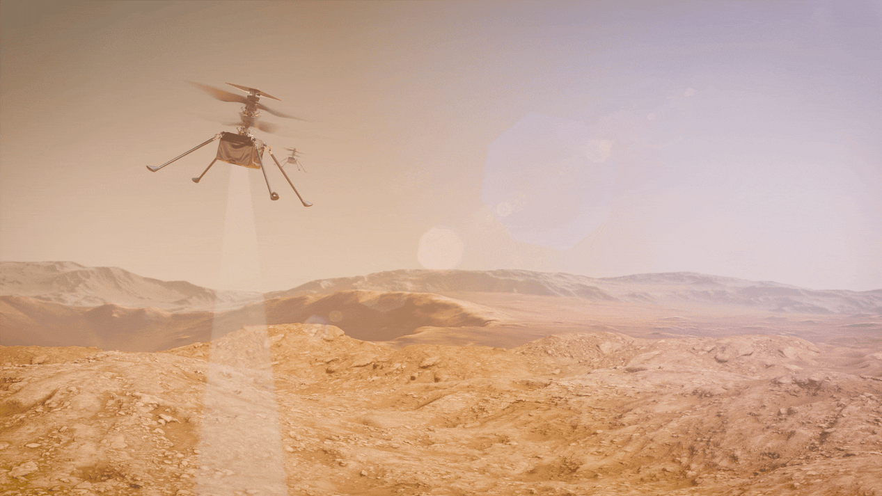 Artist's concept of two SkyFall robotic helicopters flying in tandem over a rugged Martian landscape, flying from left to right. In the upper left foreground, the primary helicopter is shown in mid-flight with its dual coaxial rotors spinning, while a second, identical helicopter trails slightly behind it in the distance. Both spacecraft are projecting pale, translucent, cone-shaped sensor beams downward, representing scans with their their ground penetrating radar on the reddish-brown rocky ridges and sandy dunes below. The background features distant crater rims and mountains under a hazy, pale orange sky, accented by a prominent diagonal string of hexagonal pink and purple lens flares.