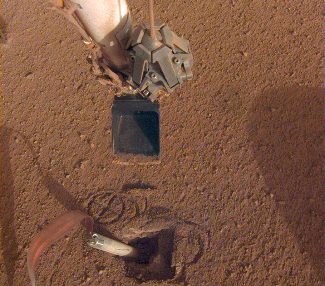 NASA's Mars InSight lander recently moved its robotic arm closer to the heat probe's digging device, called the "mole," in preparation to push on its top, or back cap.
