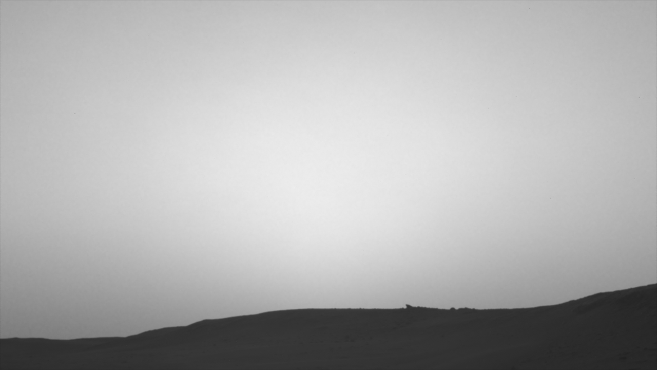 This series of images shows the shadow of Phobos as it sweeps over NASA's Curiosity Mars rover and darkens the sunlight on Monday, March 25, 2019 (Sol 2358).