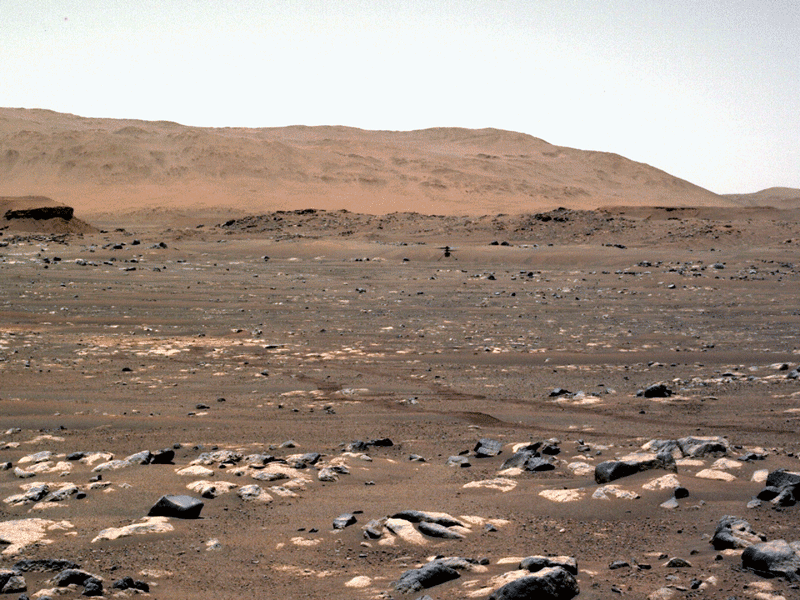 NASA’s Ingenuity Mars Helicopter achieves powered, controlled flight for the first time on another planet, hovering for several seconds before touching back down on April 19, 2021. The image was taken by the left Navcam aboard the agency’s Perseverance Mars rover.