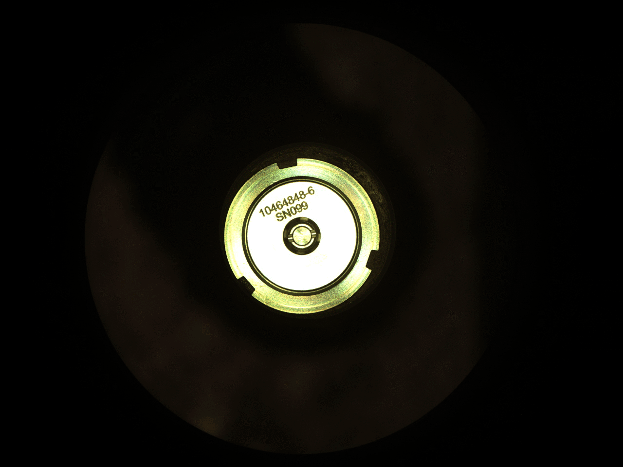 This is a colored image of Perseverance’s first cored sample of Mars rock is sealed inside its titanium container tube in this image taken by rover’s Sampling and Caching System Camera (known as CacheCam). The image was taken on Sept. 6, 2021 (the 194th sol, or Martian day, of the mission), after the seal was attached and hermetically fixed in place onto the tube. The seal’s item and serial numbers can be seen near the center of the disk.