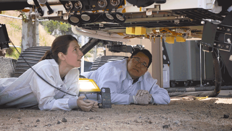 Engineers use OPTIMISM, a full-size replica of NASA’s Perseverance rover, to test how it will deposit its first sample tube on the Martian surface.