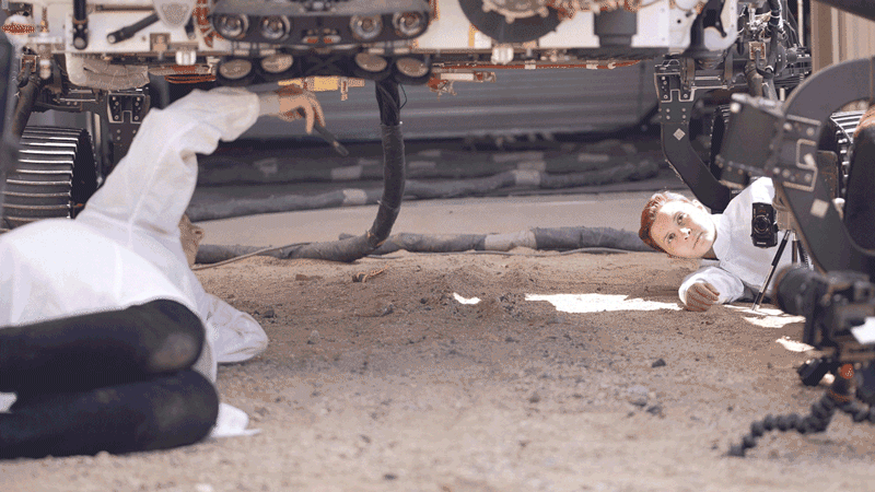 Engineers react with surprise while testing how NASA’s Perseverance rover will deposit its sample tubes on the Martian surface.