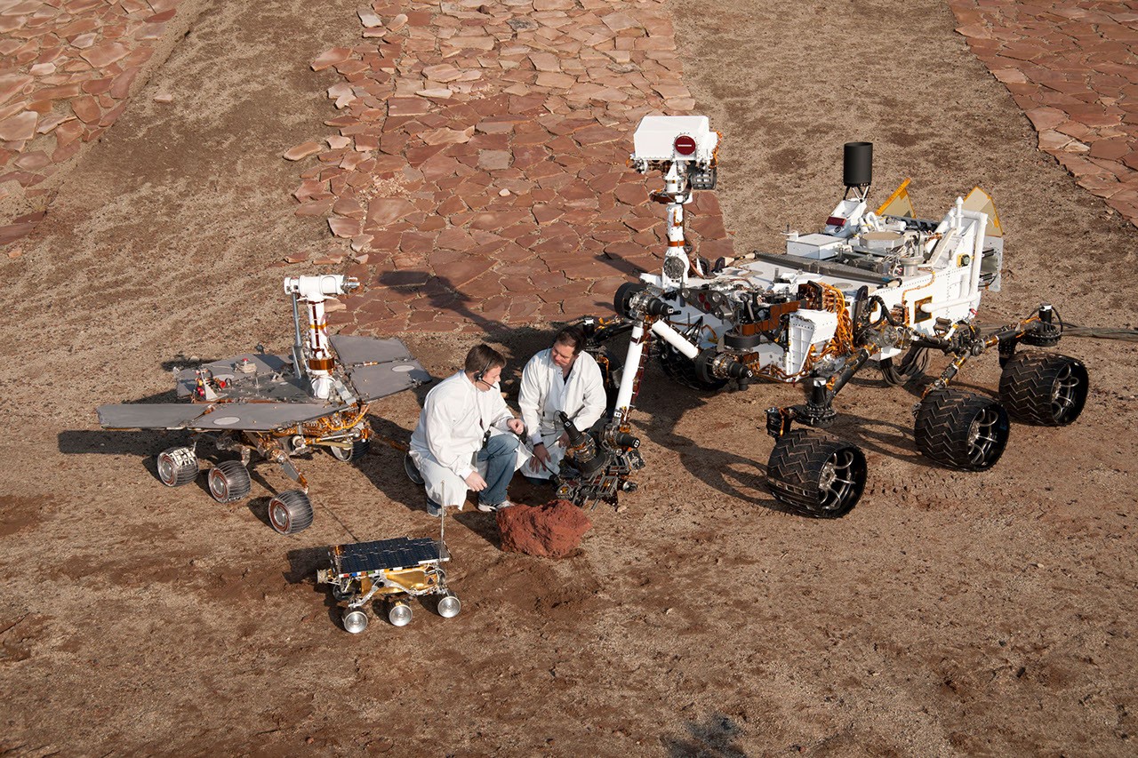 Three Generations of Rovers with Crouching Engineers - NASA Science