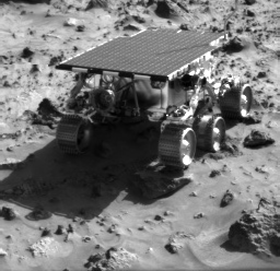 The Mars Pathfinder rover driving away.