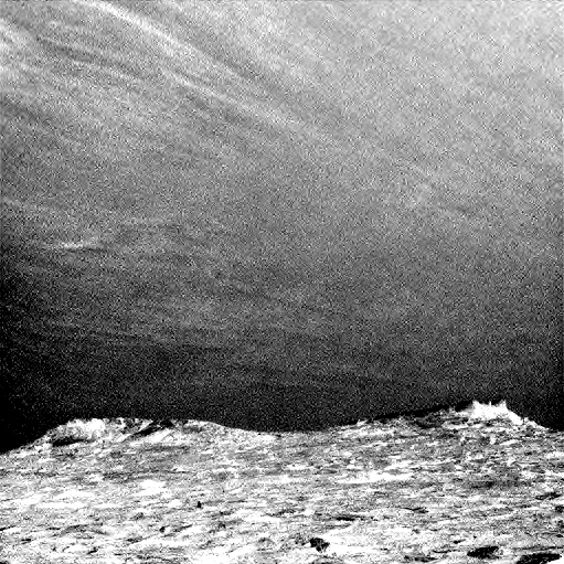 Clouds drift across the sky above a Martian horizon in this accelerated sequence of enhanced images taken on July 17, 2017, by the Navcam on NASA's Curiosity Mars rover.