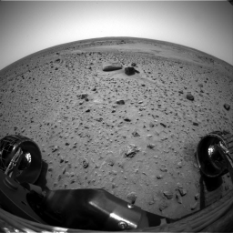 This still from an animation composed of four images taken by the front hazard-identification camera on NASA's Mars Exploration Rover Spirit, shows the rover stretching out its robotic arm, or instrument deployment device.