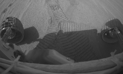 This image shows NASA's Mars Exploration Rover Opportunity digging a trench near the trough dubbed 'Anatolia' with its left front wheel on sol 73. It was taken by the rover's hazard-avoidance camera.