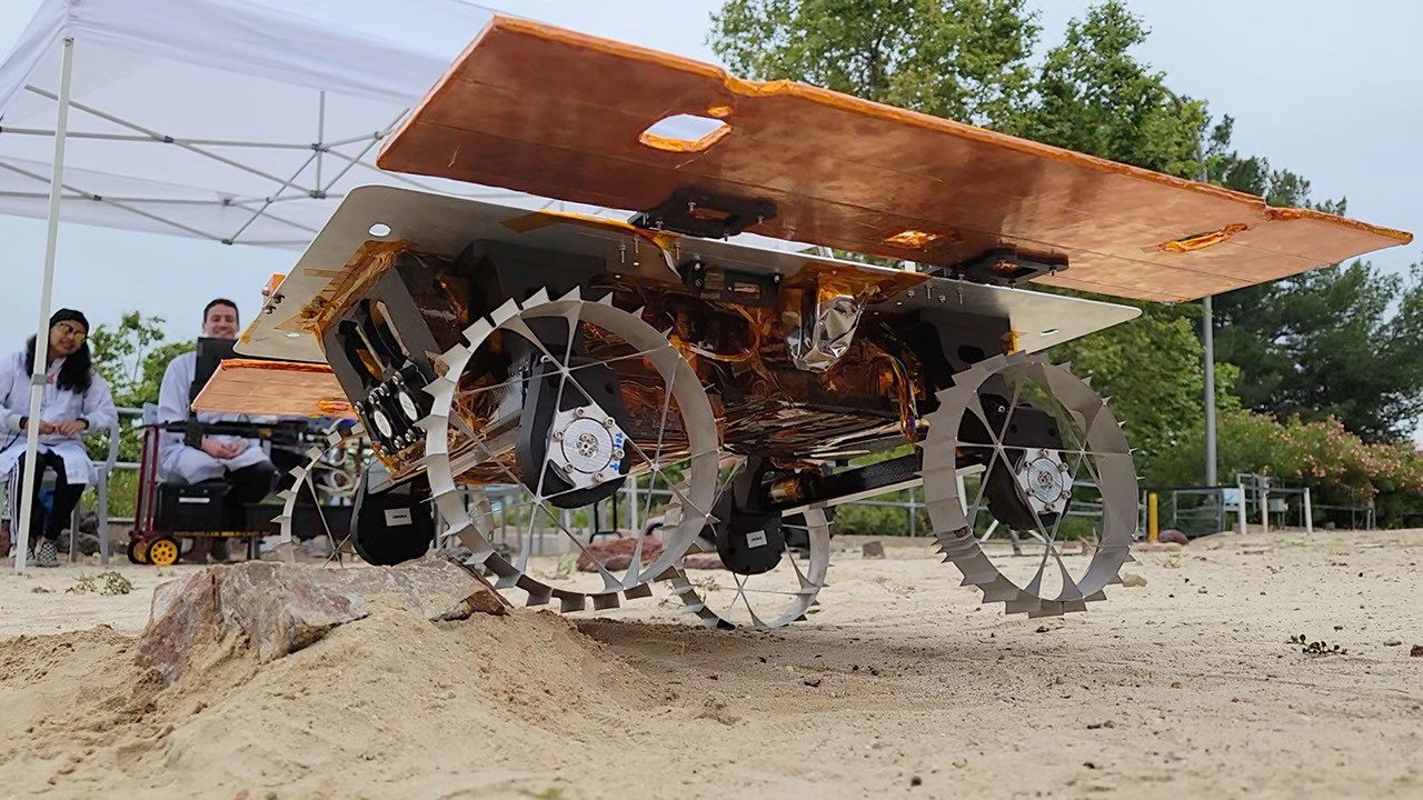 Small Spacecraft Rover Offloading CADRE Mini Rover Drives Over a Rock - NASA Science