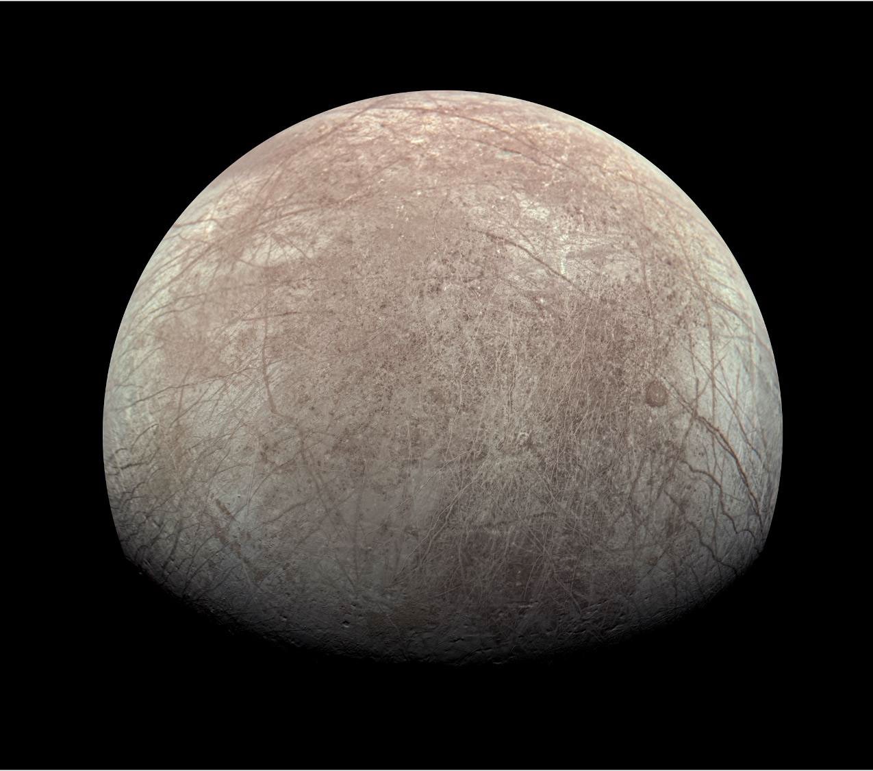 JunoCam composite view of Europa from the 2022 flyby, showing the moon's fractured icy surface in broad regional context