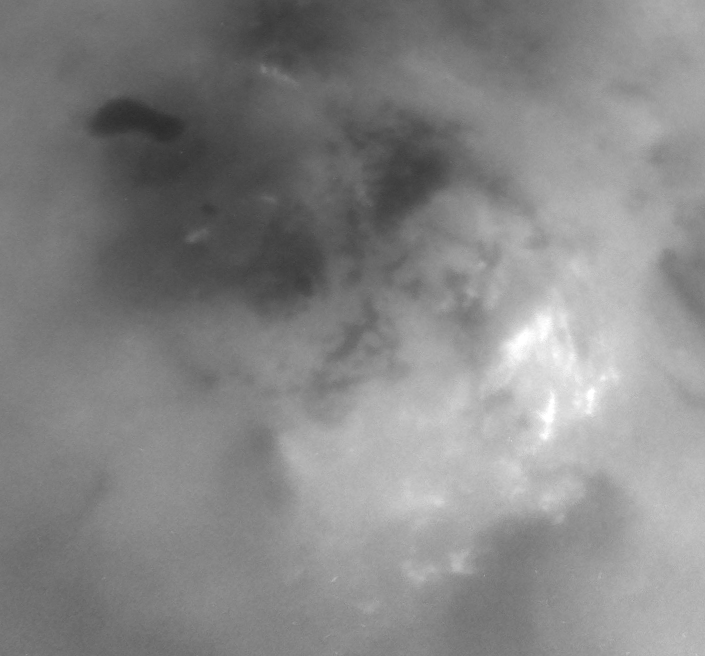 Three images, centered on the pole, show the evolution of bright clouds in the region