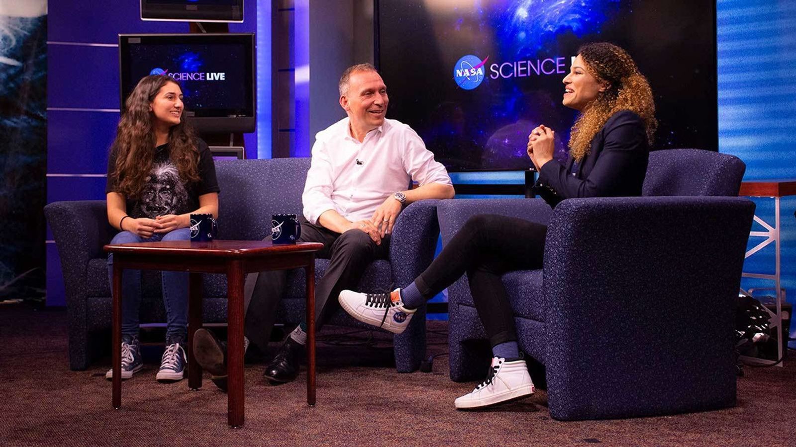 Ana Humphrey, a high school student, appears with Dr. Thomas Zurbuchen and Sophia Roberts on the NASA Science Live talkshow run out of Goddard Space Flight Center.