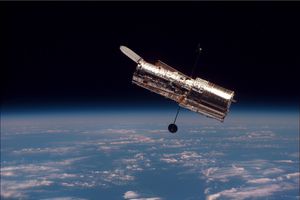 The Hubble space telescope, shown, teamed up with the W. M. Keck Observatory in Hawaii to discover a Uranus-sized exoplanet using an exotic technique: microlensing.