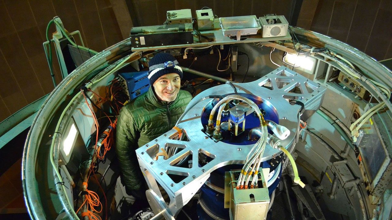 Mark Swain, an astrophysicist at JPL, stands in the "cage" of the Hale Telescope with the NESSI instrument on Feb. 2, 2018. Image credit: NASA/JPL-Caltech