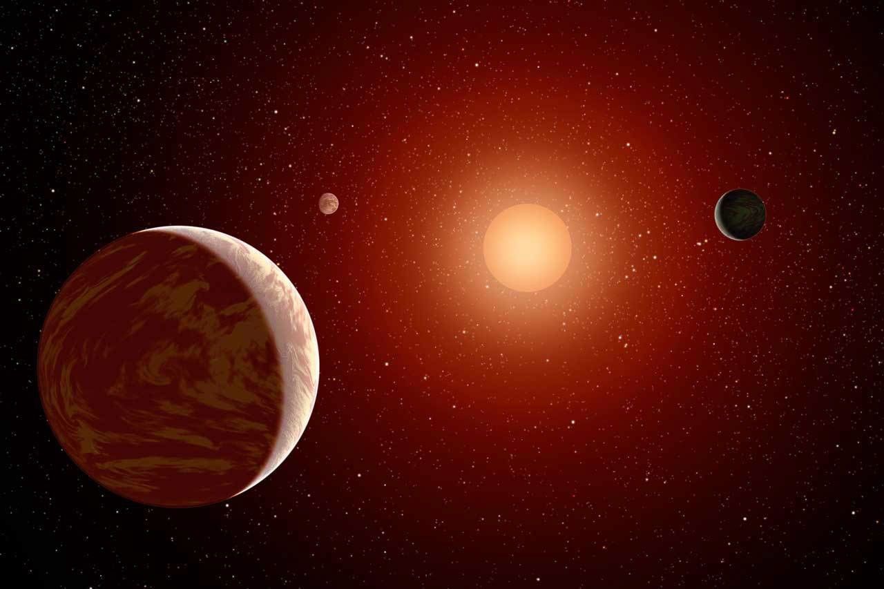 An M dwarf star is seen with three exoplanets.