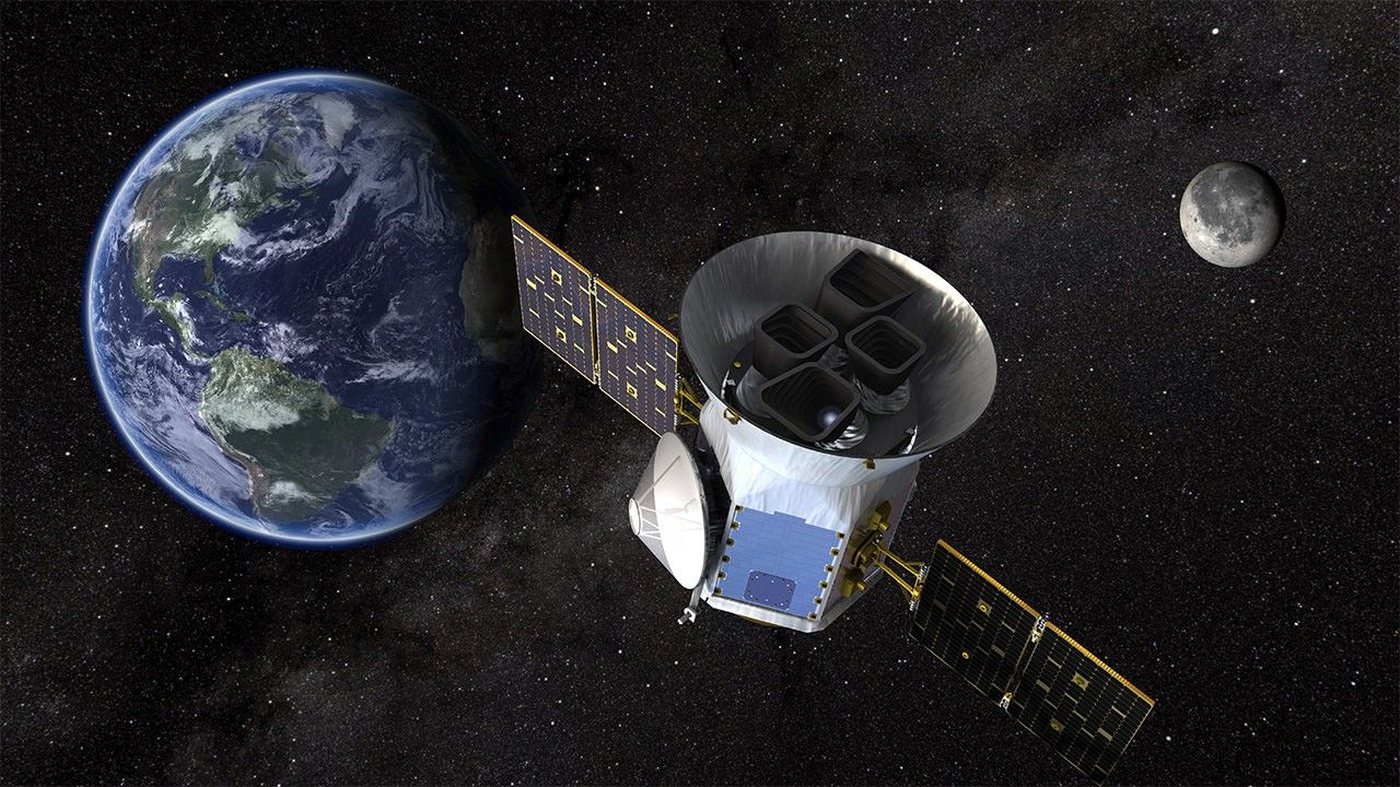 An artist's concept of TESS, with Earth in the background.