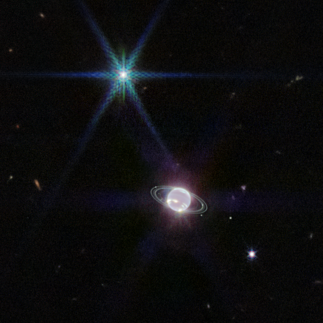 Neptune as seen by the Webb telescope, shimmering and opalescent against a black sky, with whitish rings.
