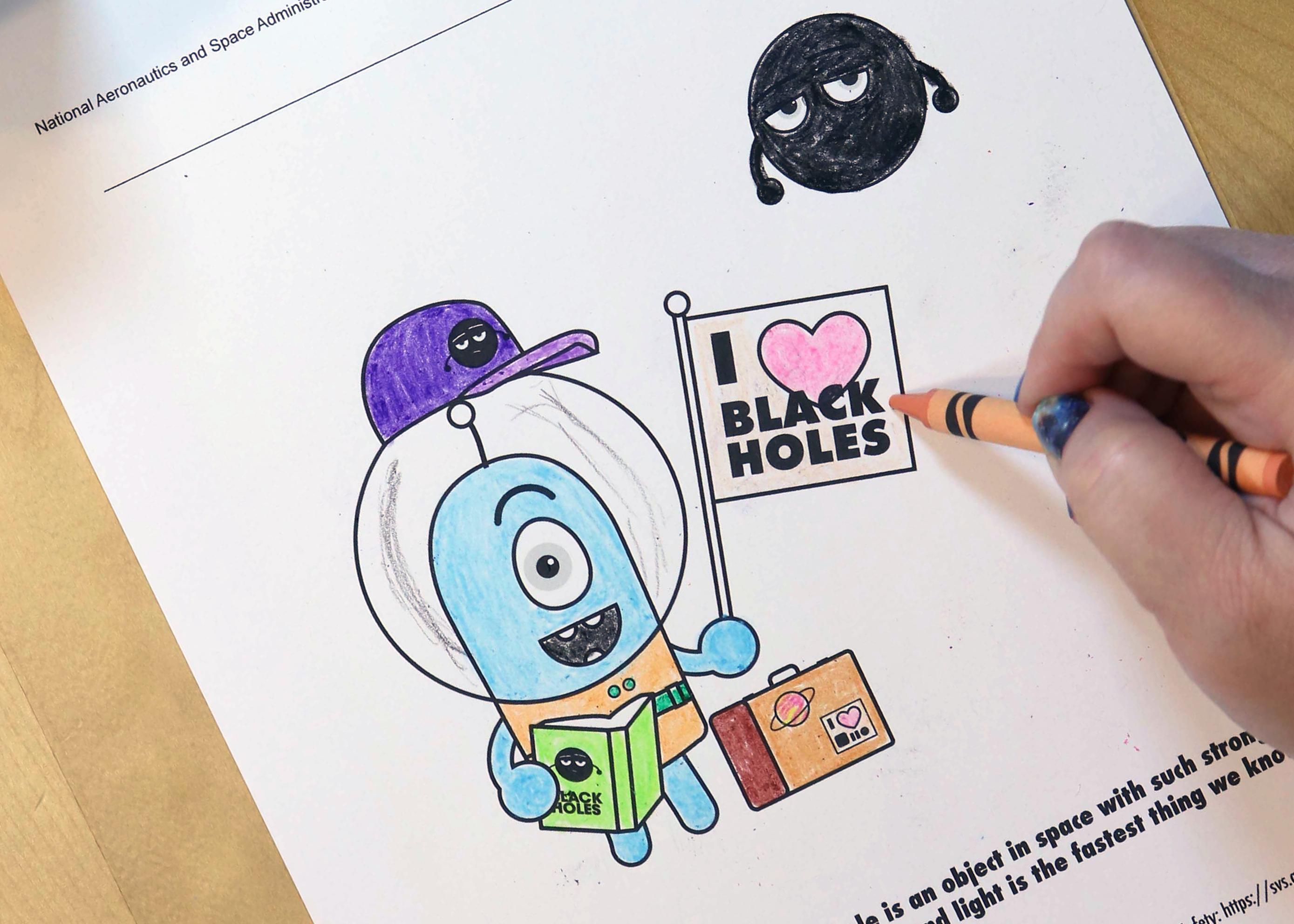 Photo of one of NASA’s Traveler coloring pages in progress.