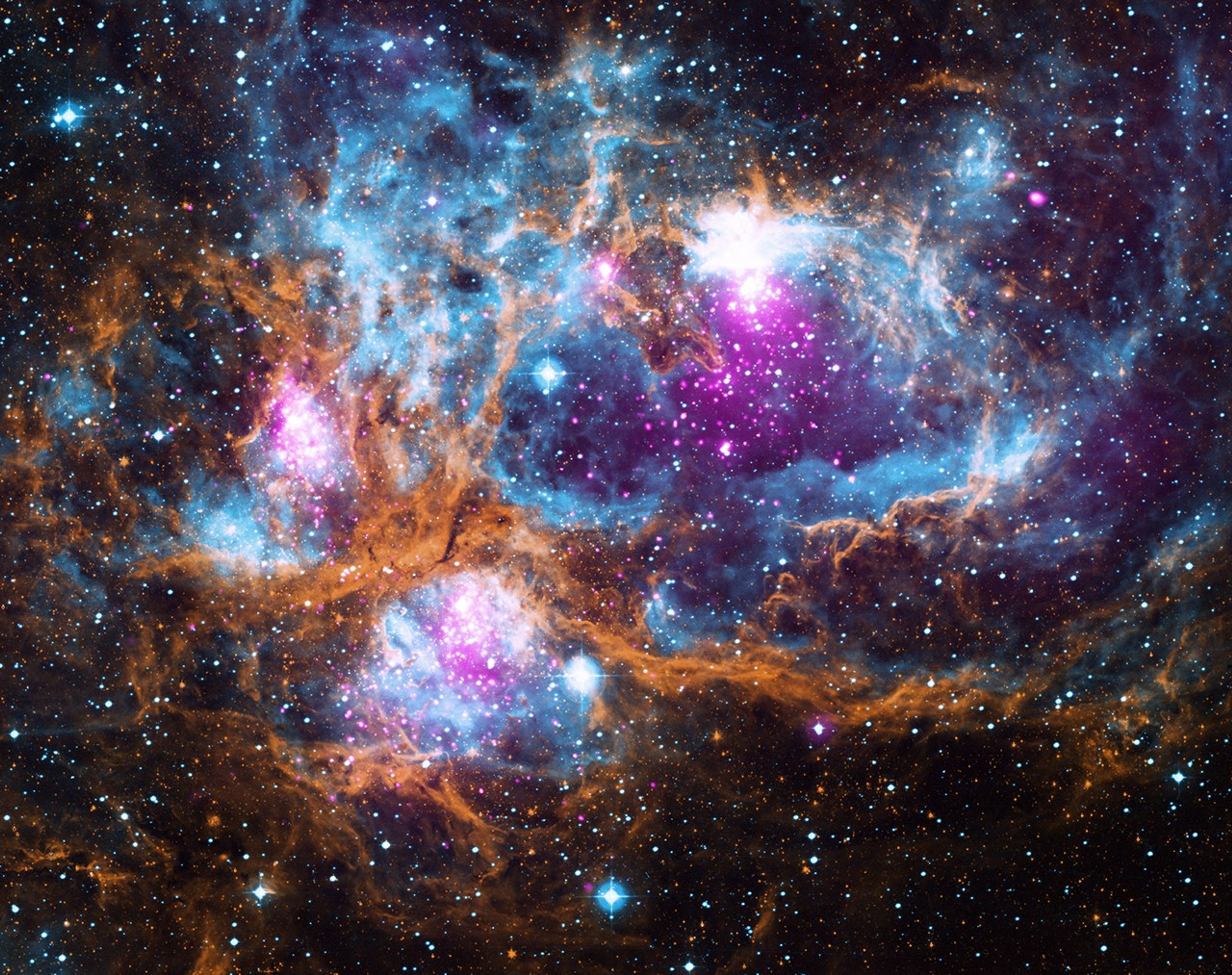 A vibrant nebula in space with swirling clouds of blue, pink, and orange gases, dotted with bright stars against a dark backdrop.